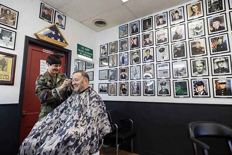 Erin Dietrich, owner/operator of Patriot Barber Shop of Oregon, works on client Charlie Kitzmiller Tuesday, Oct. 10, 2023.