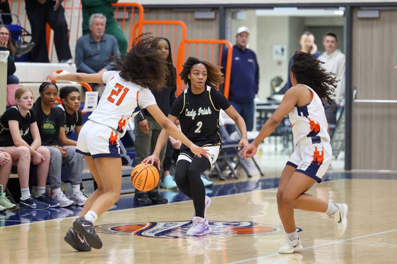Bishop McNamara’s Hailey Jackson brings the ball up as defenders set a trap during the Fightin’ Irish’s 46-32 loss to Pontiac in the IHSA Class 2A Pontiac Sectional semifinal on Tuesday, Feb. 24, 2026, at Pontiac Township High School.