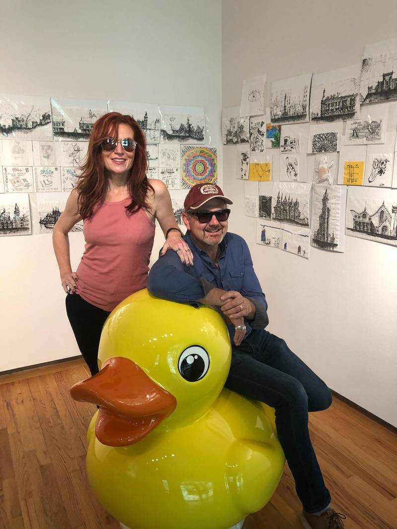 Pictured Wendy Streit, chair of Lockport's summer art series, and Mayor Steve Streit, also a former art instructor at the Illinois Institute of Art. They are posing with one of two ducks that were painted to look like the traditional yellow rubber duck. The other, customized ducks are in the process of being assigned to the Illinois State Museum selected artists.