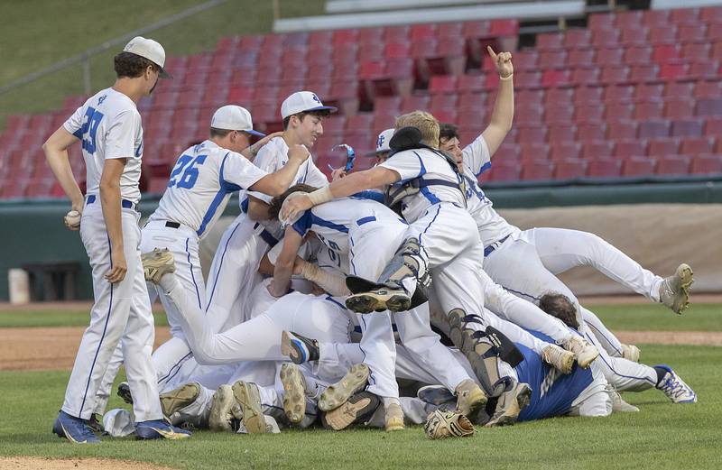 The Newman Comets celebrate their 5-1 win over Chicago Hope Monday, June 2, 2025, during the Class 2A Supersectional at Northwestern Medicine Field in Geneva.