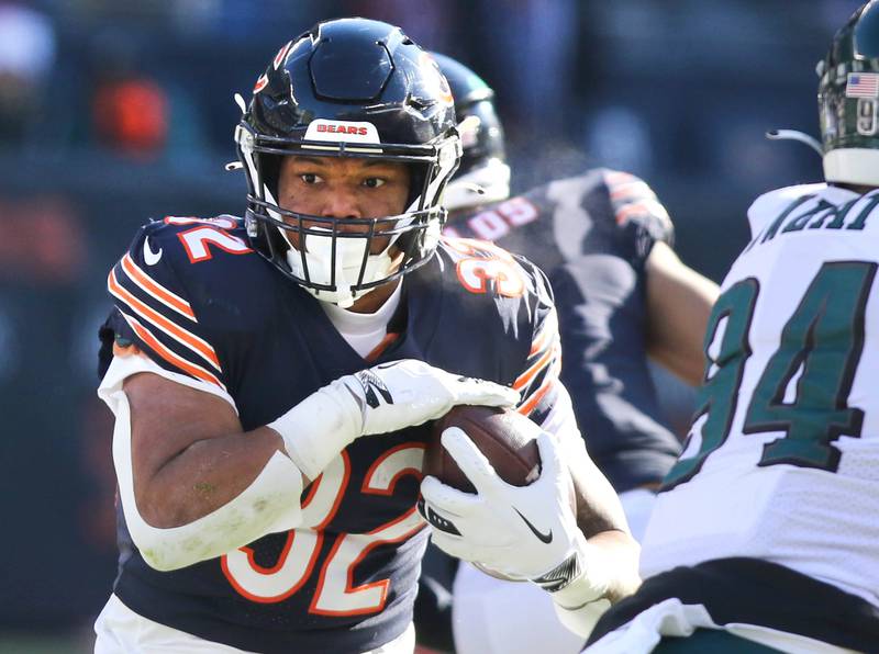 Chicago Bears running back David Montgomery looks to get by Philadelphia Eagles defensive end Josh Sweat during their game Sunday, Dec. 18, 2022, at Soldier Field in Chicago.