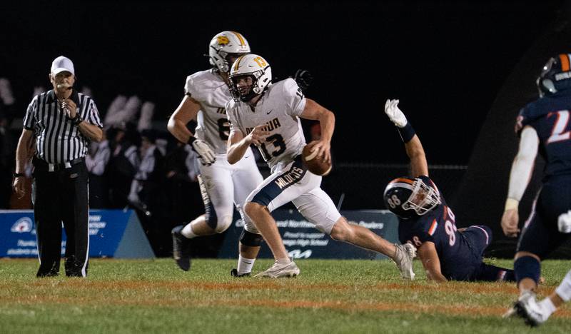 Neuqua Valley's Mark Mennecke (13) carries the ball on a keeper against Oswego during a football game at Oswego High School on Friday, Aug 26, 2022.