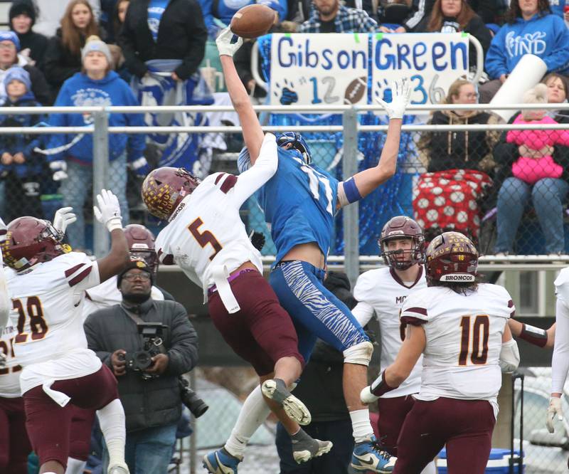 Princeton's Noah LaPorte leaps in the air but fails to catch this pass over Montini Catholic's Max Bell during the Class 3A quarterfinal game on Saturday, Nov. 16, 2024 at Bryant Field in Princeton.