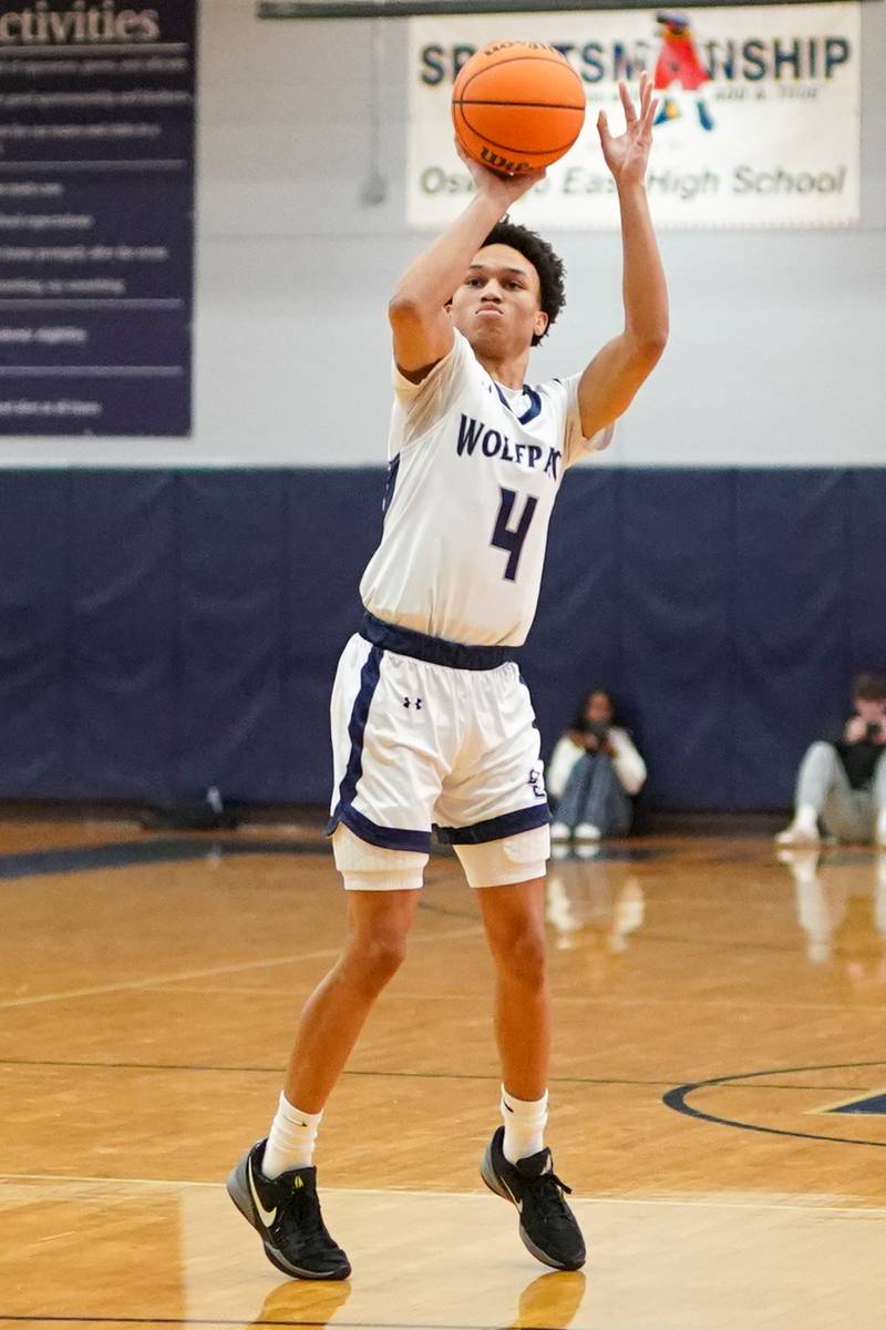 Oswego’s Tyrell Mays (4) shoots a three pointer during a basketball game against Oswego at Oswego East High School on Saturday, January 14, 2017.