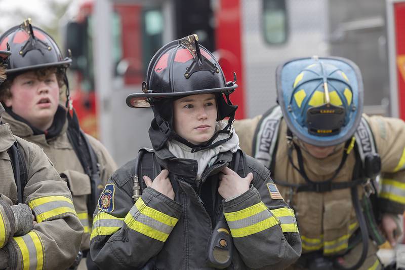 Emma Chandler, 18, of Amboy, listens to instruction Saturday, March 15, 2025, during cadet firefighter training in Amboy.