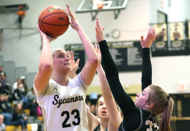 Sycamore's Evyn Carrier shoots over Kaneland's Kendra Brown during the Class 3A regional final game Friday, Feb. 17, 2023, at Sycamore High School.