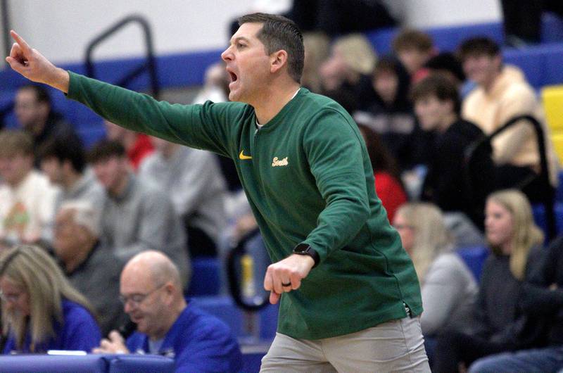 Crystal Lake South’s Head Coach Matt LePage guides the Gators against Huntley in varsity basketball tournament title game action at Johnsburg Friday.