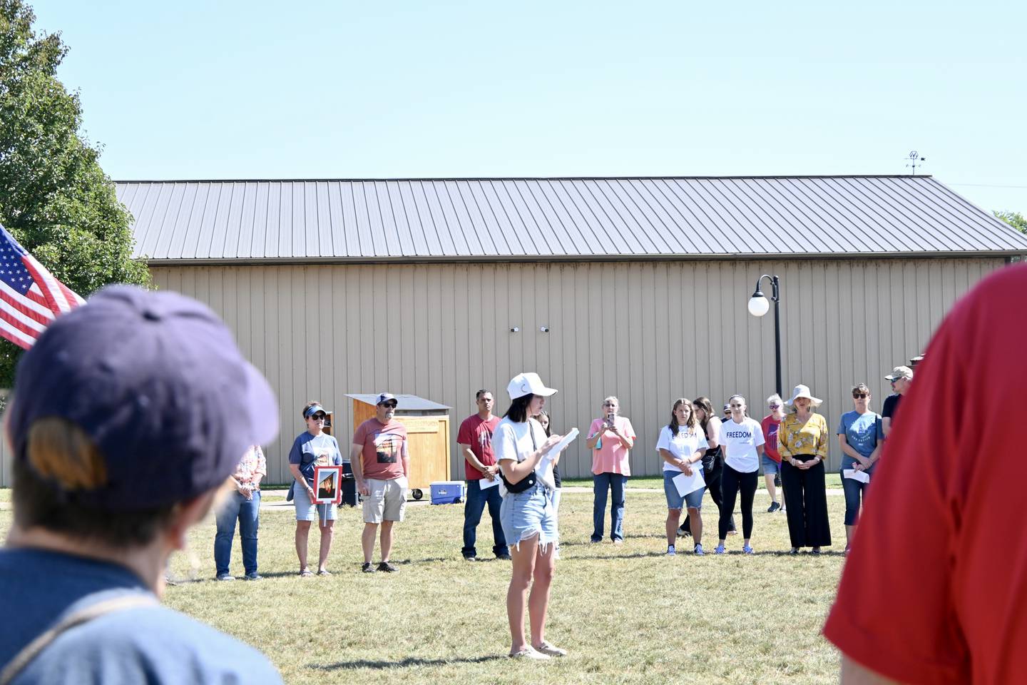 Emma Mote, a Windy Field Representative for Turning Point USA, speaks at Charlie Kirk's vigil on Sunday, Sept. 14, 2025, at Knudson Park in Marseilles.
