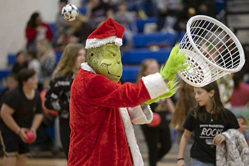 Grinch uses all sorts of tactics to get one up on the kids Saturday, Nov. 18, 2023. Very few rules were imposted during the chaotic event. All kids got unlimited lives but had to tag the back wall after being pelted with a ball.