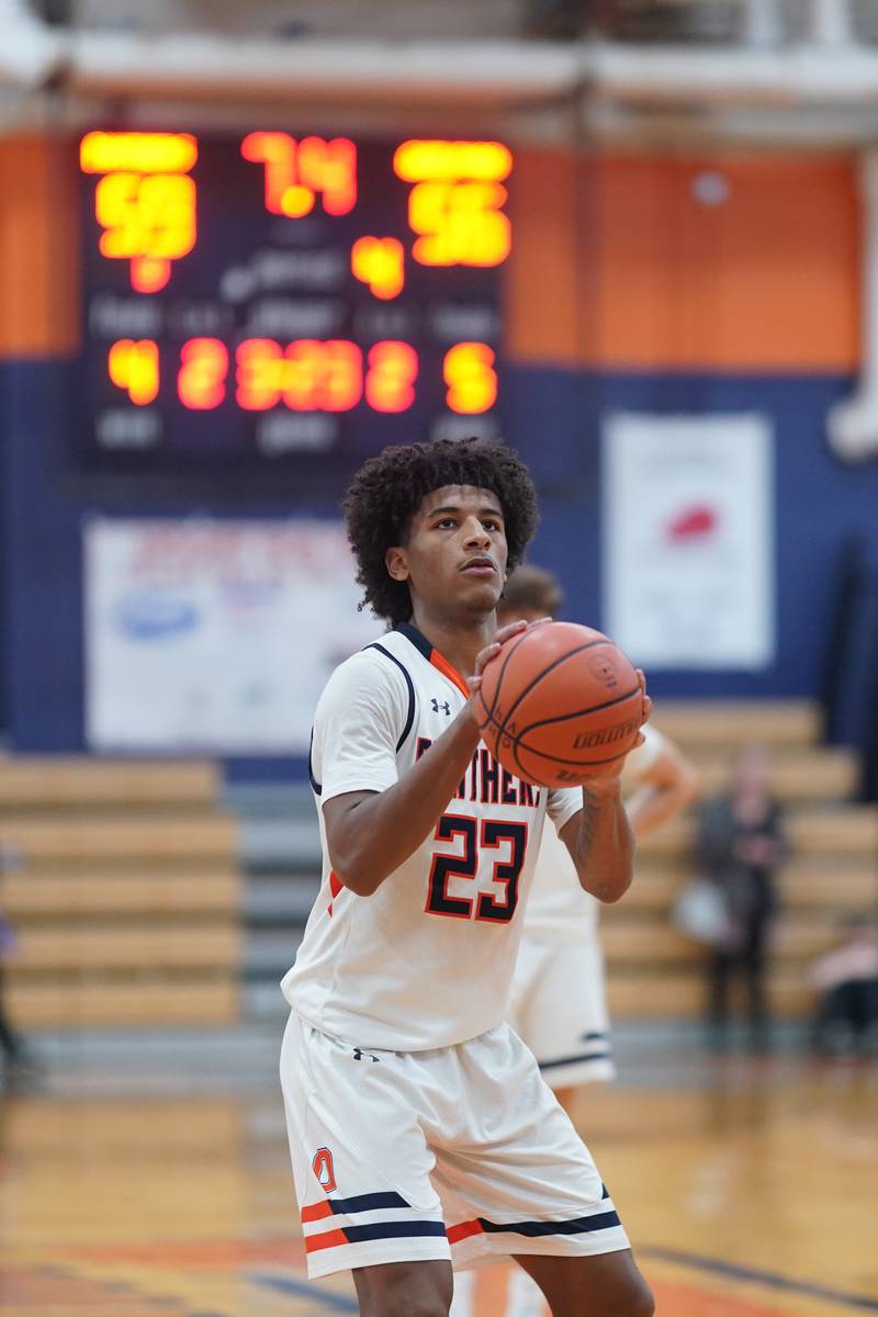 Oswego’s Dasean Patton (23) shoots a free throw late in the 4th quarter of play against Rockford Guilford during a hoops for healing basketball tournament game at Oswego on Monday, Nov. 25, 2024.