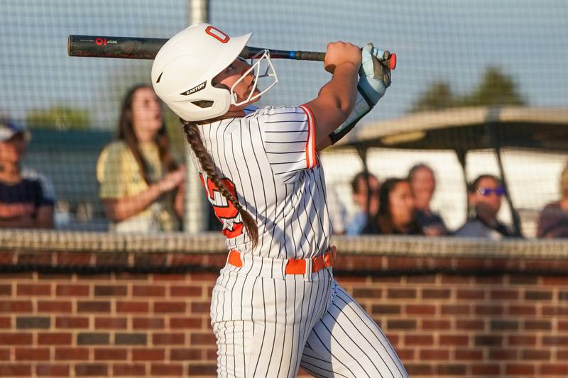 Oswego’s Aubriella Garza (12) drives in a run on a deep sacrifice fly against Minooka during a Southwest Prairie Conference softball game at Oswego High School on Wednesday, April 23, 2025.