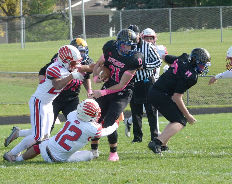 Oregon's Anthony Bauer (12) and Lucas Cole (28) try and tackle Durand-Pecatonica's Connor Hughes during 3A playoff action on Saturday, Oct. 28, 2023 at Pecatonica High School.