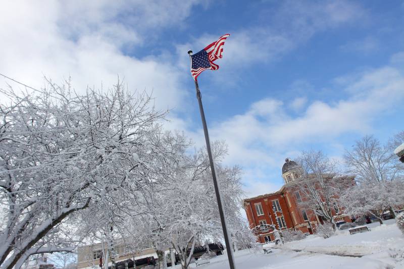 The Woodstock Square is covered Saturday in the wake of overnight snow. Bitter cold is expected to worsen into Sunday, the National Weather Service warned.