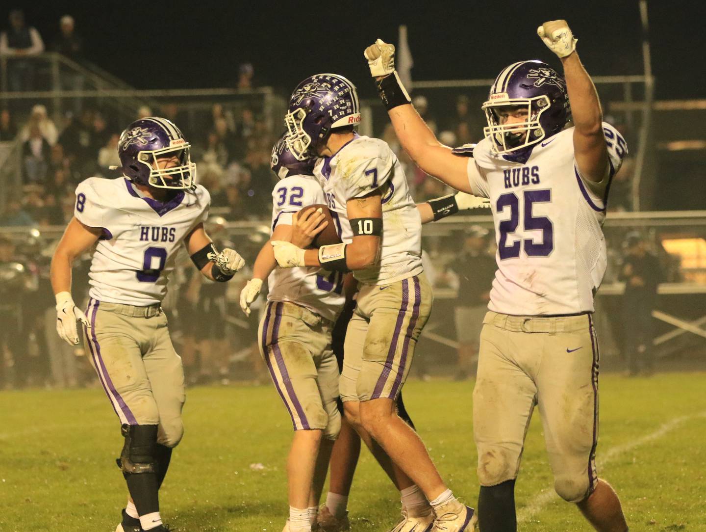 Rochelle football players celebrate during their win at Kaneland on Friday, Oct. 10, 2025.