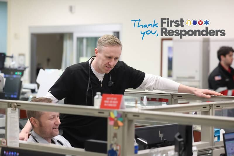 Dr. Mark Bamman gets reports at the start of his evening shift at the Silver Cross Emergency Department on Thursday, April 18, 2024 in New Lenox.