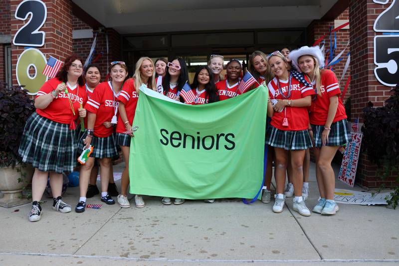 Some members of Woodlands Academy’s Class of 2025 celebrate their newfound status with a banner proclaiming it as part of “Seniors Rule” festivities prior to the start of classes on Aug. 20. There was an underlying Olympics theme honoring Team USA.