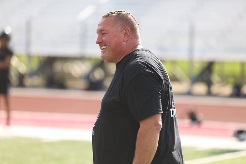 Bolingbrook head coach John Ivlow has a laugh between plays at the Morris 7 on 7 scrimmage. Tuesday, July 19, 2022 in Morris.