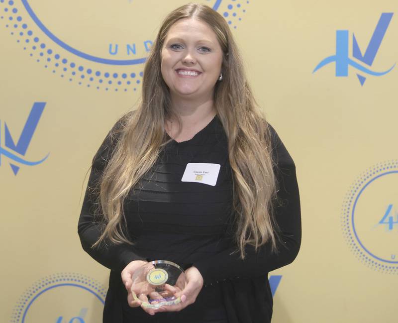 Cassie Essl poses with her 40 Under Forty award during the Illinois Valley Chamber of Commerce Champions of Change Awards Night on Wednesday, May 6, 2026 at the Westclox Event Center in Peru.