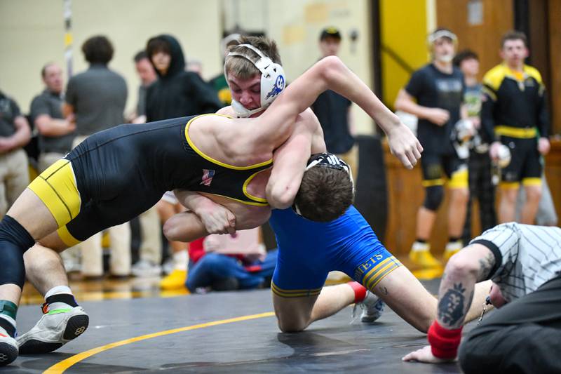 Central-Iroquois West's Evan Cox moves to pin Reed-Custer's Conor Kochanny during Cox's 144-pound match victory on Saturday, Feb. 8, 2025, in the IHSA Class 1A Herscher regional.