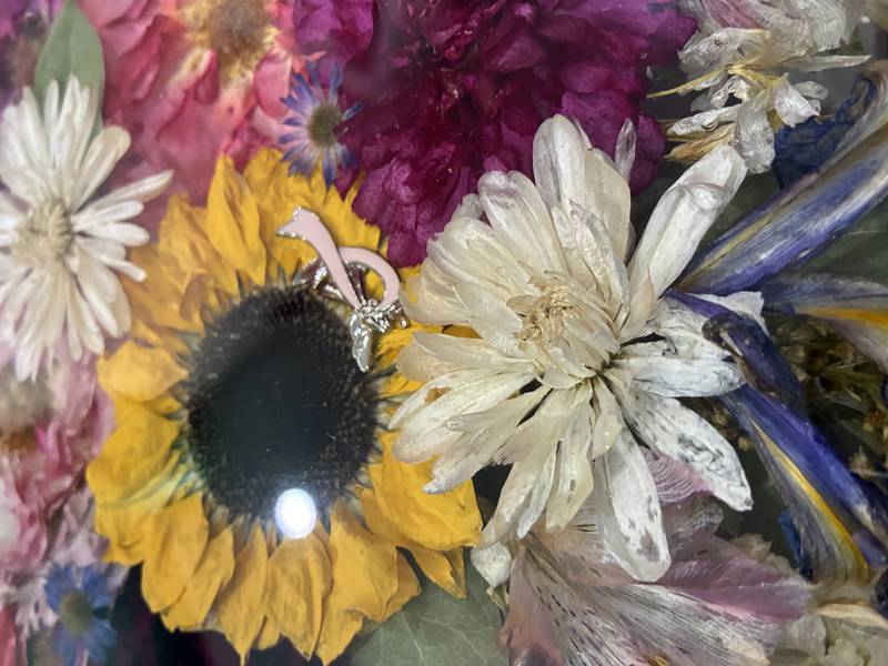 Dried flowers from a memorial arrangement at Bupp Woodworks & Designs on Nov. 28, 2025. The McHenry-based business encase the flowers in resin to preserve them.