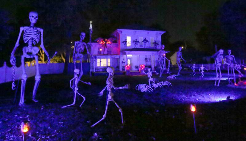 This home in the 1300 block of Ottawa Avenue has spooky blue lighting on skeletons surrounding the home on Sunday, Oct. 20, 2024 in Ottawa.