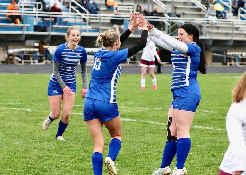 Princeton's Madie Gibson (15) celebrates her goal with teammate Riley Rauh during Tuesday's soccer match at Bryant Field against IVC. The Tigresses won 9-0.