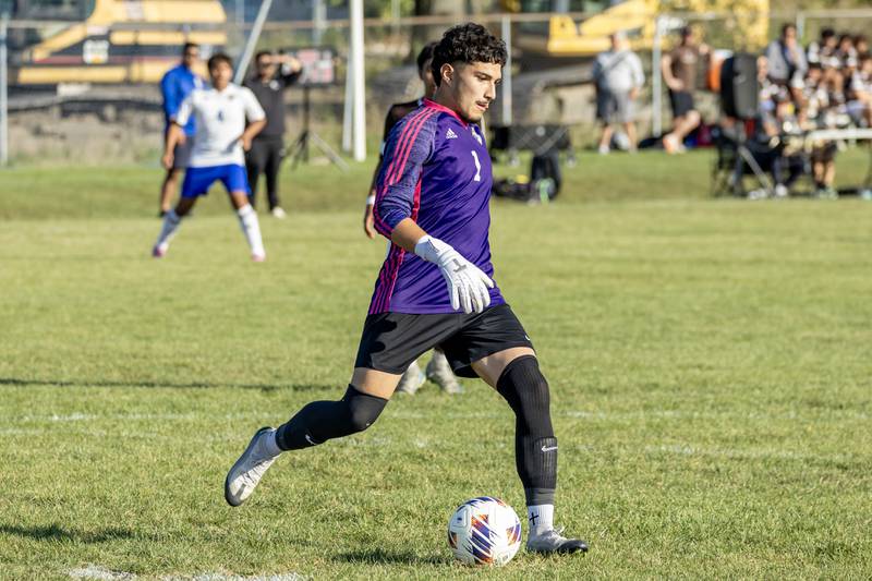 Joliet Central's Chris Torres passes to a teammate during a varsity soccer game against Joliet Catholic at Joliet Catholic on Sept. 8, 2025.