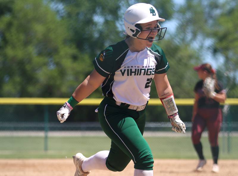 North Boone’s Danielle Goodman celebrates her home run during Class 2A softball sectional final action against Richmond-Burton at Marengo Saturday.