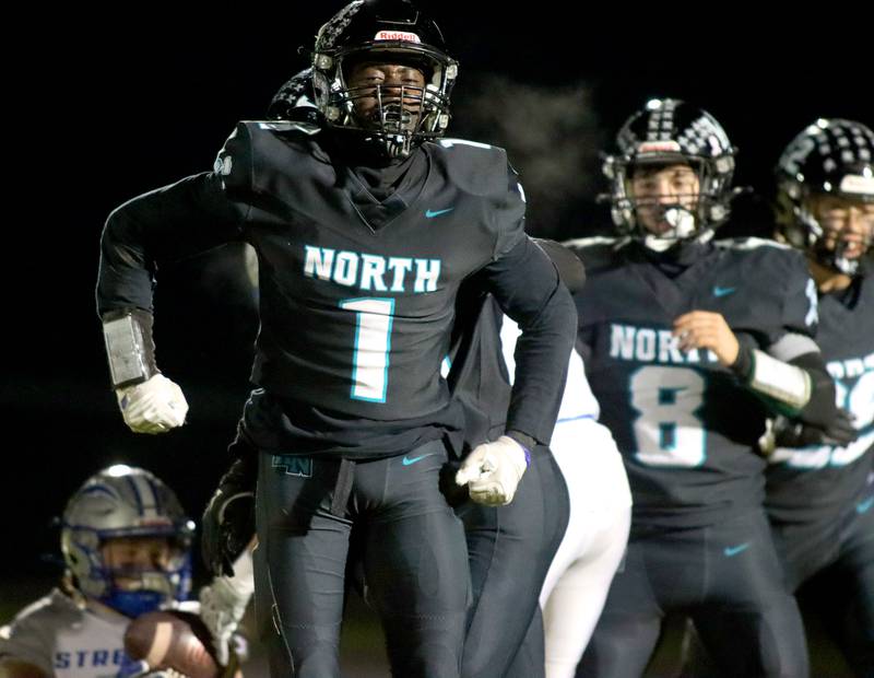 Woodstock North’s JR Fadahunsi celebrates a defensive stop against Woodstock in varsity football at Woodstock North High School on Friday, October 24, 2025.