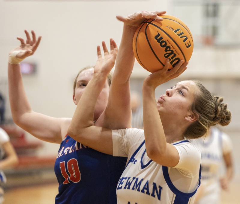 Newman’s Brooklyn Smith has a shot blocked by Eastland’s Izzy Ames Tuesday, Feb. 18, 2025, during the Class 1A girls basketball regional at Forreston.