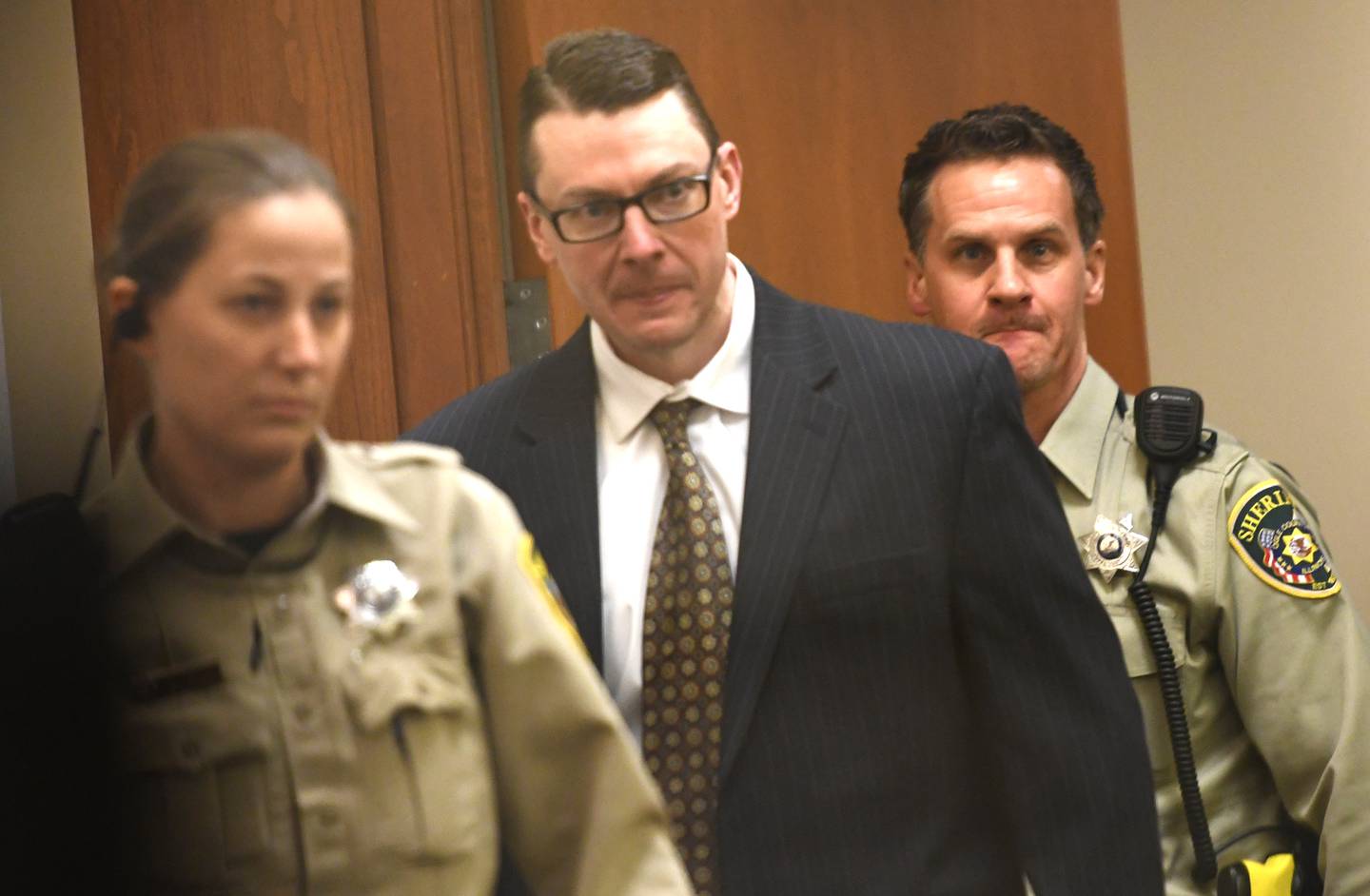 Duane "DC" Meyer is escorted into an Ogle County courtroom on Wednesday, Jan. 28, 2026 by sheriff deputies Carla Hill  and Dan Daub at the Ogle County Judicial Center in Oregon.