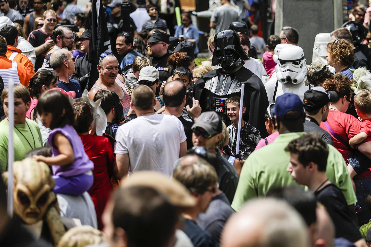 Darth Vader poses for pictures  during the Joliet Public Library's fifth annual Star Wars Day on Saturday, June 7, 2014.