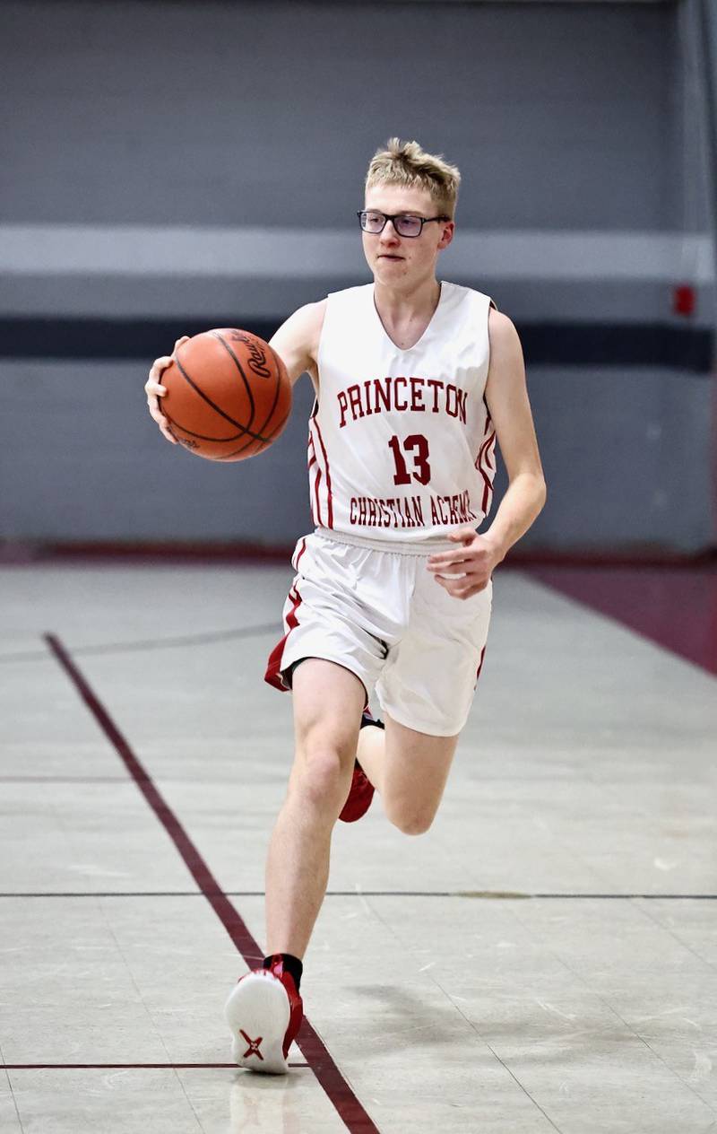 PCA's Trustin Crew brings the ball upcourt in Thursday's JV game at Howard Hoffman Memorial Gymnasium.