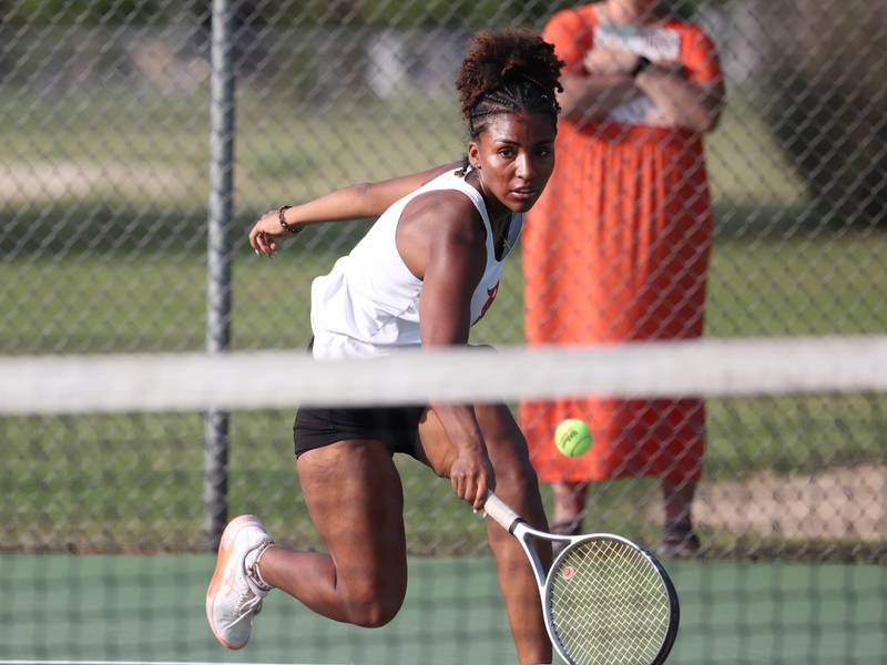 DeKalb’s Krystal Baggett reaches for a backhand during her match against Sycamore Wednesday, Sept. 18, 2024, at Sycamore High School.