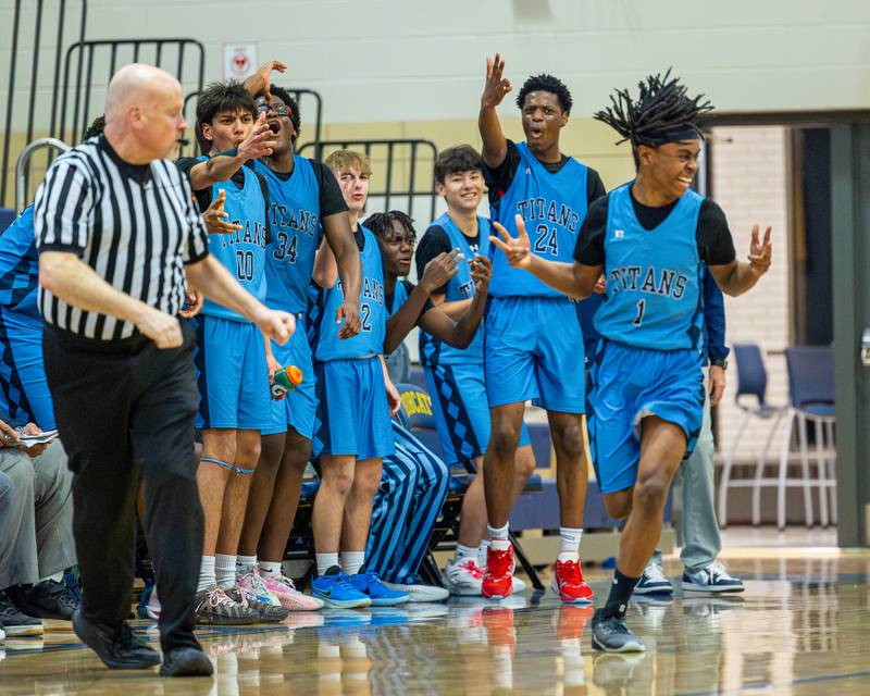 IMSA's bench celebrates teammate Marshall Flynn-Mitchell's (1) made 3-pointer in the quarterfinals of the Little Ten Conference Tournament on Monday, Feb. 2, 2026 at Somonauk High School in Somonauk.