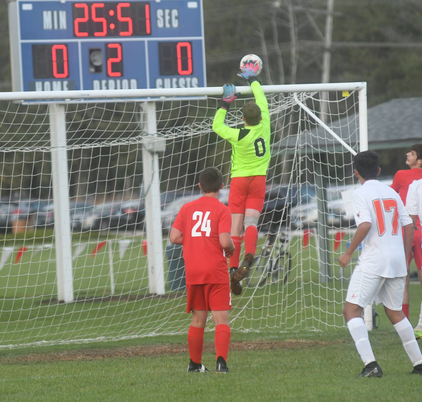 Oregon goalkeeper Gavin Morrow slaps away a Winnebago shot on goal during second period action at the Class 1A regional action at Oregon Park West on Wednesday. The Hawks won the game on penalty kicks after two overtime periods and face Genoa-Kingston in the final on Friday.