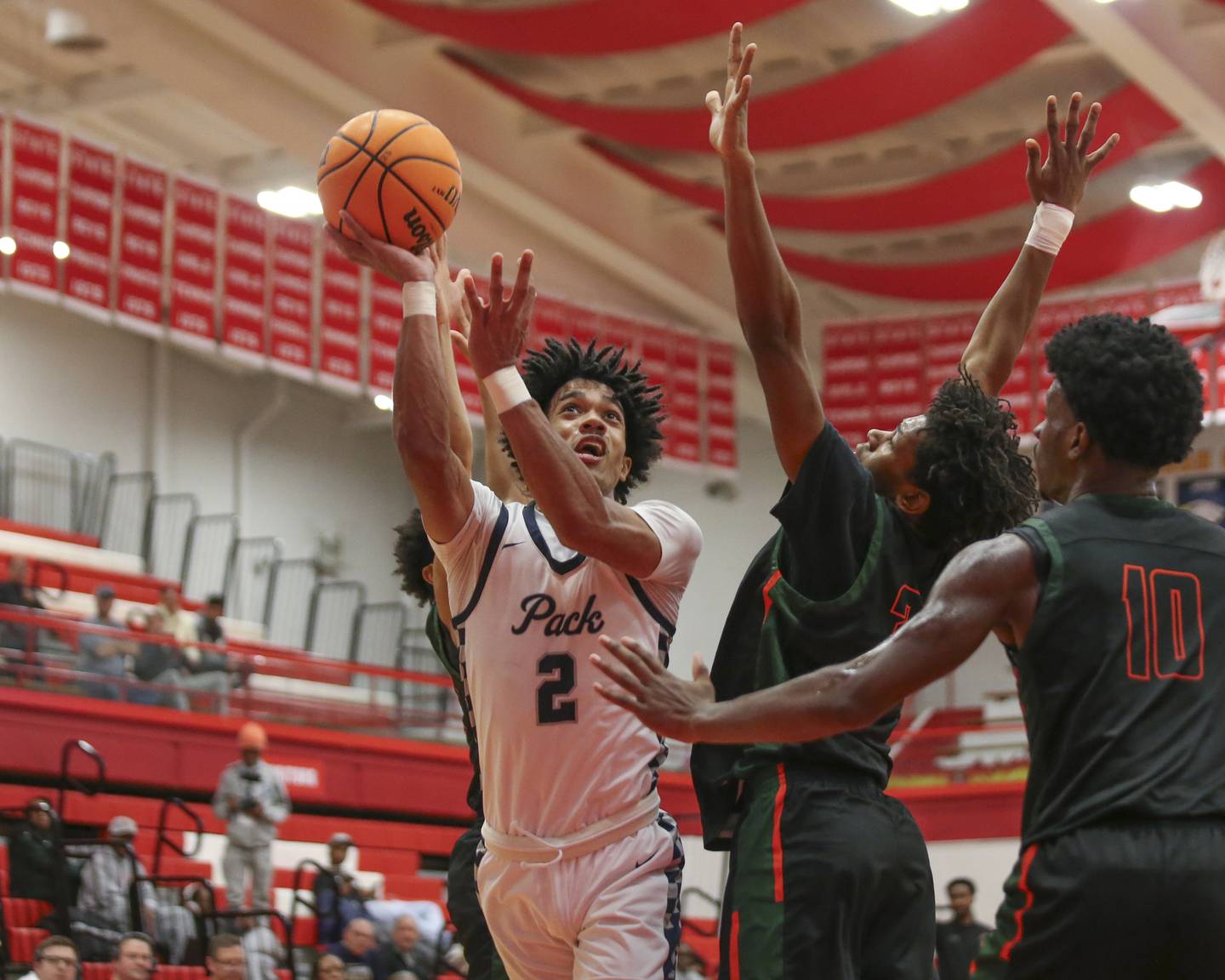 Oswego East's Jacsen Tucker (2) puts up a shot during their Hinsdale Central Holiday Classic basketball game between Morgan Park at Oswego East Saturday, Dec 27, 2025 in Hinsdale.