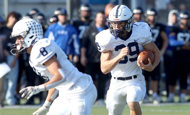 Cary-Grove’s Holden Boone scampers to the end zone on a touchdown against Highland Park in second-round IHSA Class 6A playoff action at Wolters Field in Highland Park Saturday.