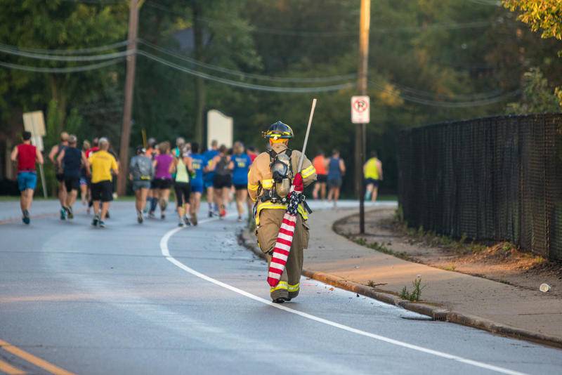 Crystal Lake firefighter runs half marathon in full gear, tank and all