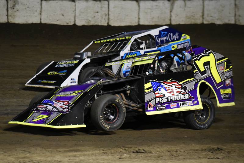 Brad DeYoung (7) races Steven Brooks in the modified feature at Kankakee County Speedway Friday, May 16, 2025.