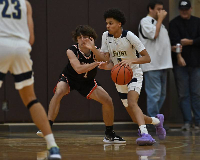 Lemont's Ryan Runaas (2) tries to drive by Minooka's Troy Hudak (1) in the WJOL Basketball Tournament on Monday, November 21, 2022, at Joliet.