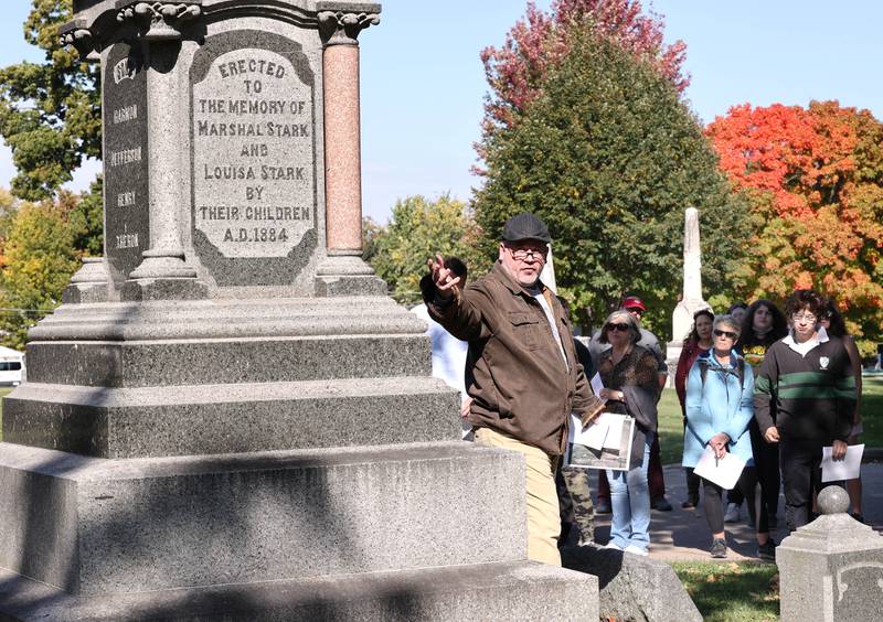 Volunteer Joe McCormick talks about the life of Marshal Stark, who was an early pioneer, during the Etched in Stone cemetery walk Sunday, Oct. 9, 2022, at Elmwood Cemetery in Sycamore. The event, hosted by the DeKalb County History Center, told the stories of some local individuals who are buried there.