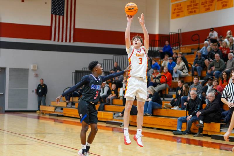 Batavia's Evan Blankenship (3) shoots a three-pointer against Marmion's David Malley (3) during a game at Batavia High School on Wednesday, Nov. 26, 2025.
