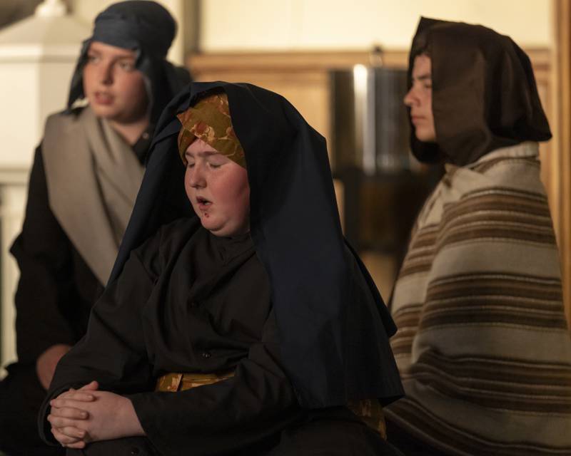 Jackson Layhew (center) and others portraying the people of Jerusalem look on as Jesus is hung from the cross during the Stations of The Cross event on April 16, 2025 at St. Patrick's Church.