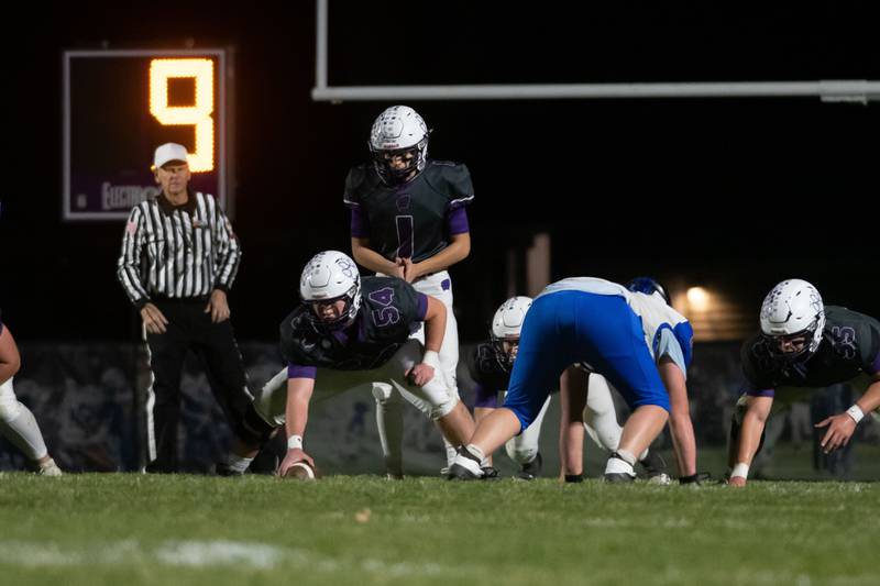 Wilmington's Jack Cutter prepares to snap the ball during the Wildcats' 49-7 victory over Tri-Valley in the quarterfinal game on Saturday, Nov. 15, 2025.