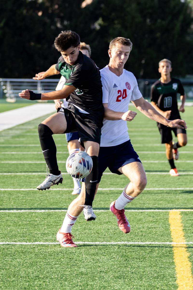 Plainfield Central’s Finn Lambert and South Elgin's Jack Schmidtke fight for control of the ball during a game at Plainfield Central on Aug. 28, 2025.