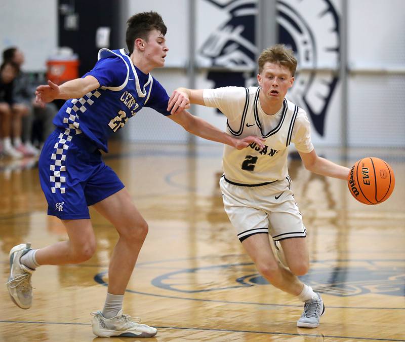 Cary-Grove's AJ Berndt (right) brings the ball up the court against Burlington Central's Cash Cumpata during a Fox Valley Conference  boys basketball game on Wednesday Jan. 7,  2026, at Cary-Grove High School, in Cary.