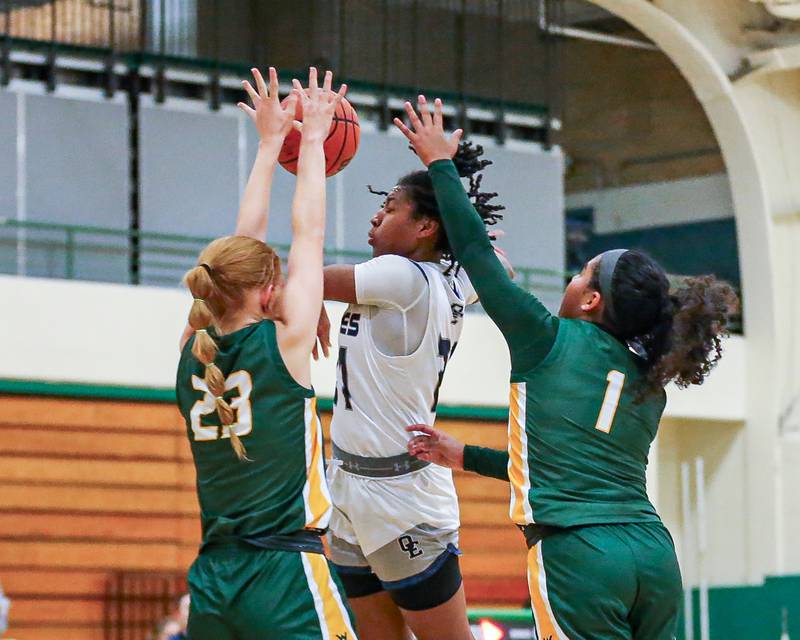 Oswego East's Desiree Merritt (21) passes off of a drive at the York Thanksgiving Tournament. Nov 13, 2023.