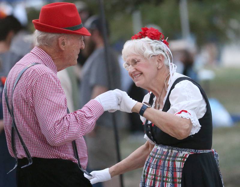 Shirley and Larry Hackmann of Washington, dance to the music from the Geidelberg German Band during the Oktoberfest event on Saturday, Oct. 18, 2025 at Rotary Park in Princeton. The Hackmann's have been dressing up for over 160 parades and festivals.