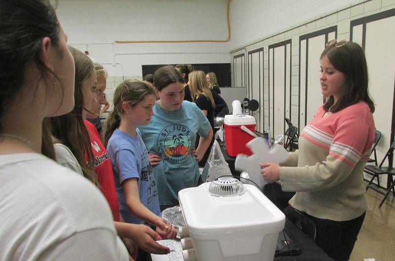 Woodland High School student Alexandria Rice demonstrates a water turbine Tuesday, May 16, 2023, during the STEM Fair. Her STEM partner Jaden Yuhas (not pictured) also helped with demonstrations.
